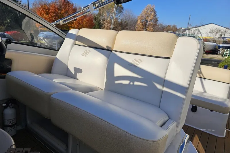 Slide: The Image of 2008 Four Winns V258 boat interior with beige seating and autumn background. - 83