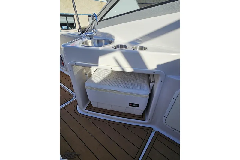 Slide: The Image of 2008 Four Winns V258 boat interior with sink and storage compartment. - 87