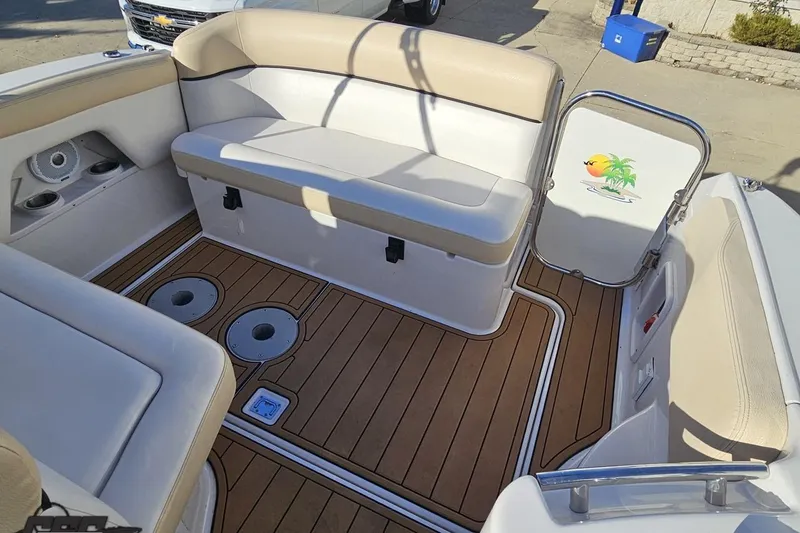 Slide: The Image of 2008 Four Winns V258 boat interior with beige seating and wood-patterned flooring. - 88