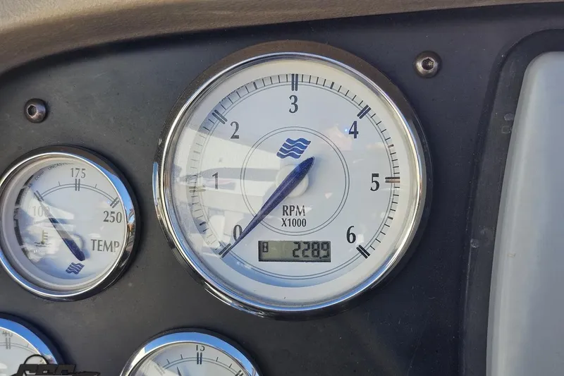 Slide: The Image of 2008 Four Winns V258 dashboard with RPM and temperature gauges. - 97