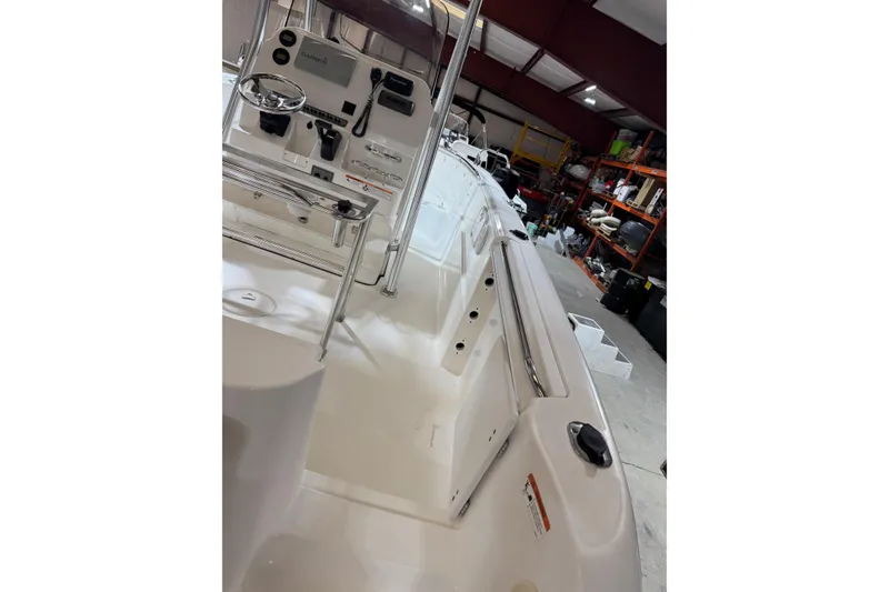 Slide: The Image of 2007 Wellcraft 232 Fisherman boat interior with control panel in a garage. - 10