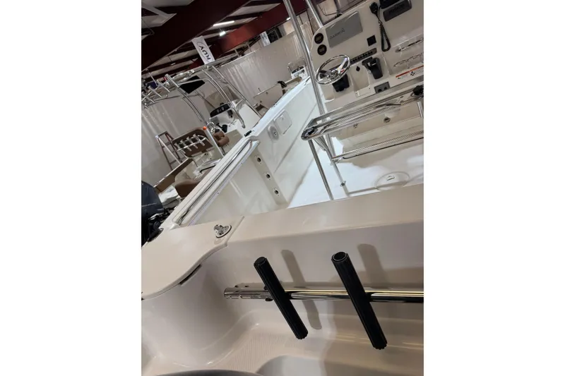Slide: The Image of 2007 Wellcraft 232 Fisherman boat interior with steering console and rod holders. - 11