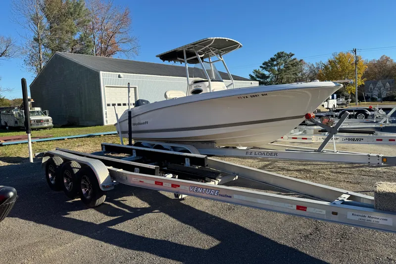 Slide: The Image of 2007 Wellcraft 232 Fisherman boat interior with Garmin equipment and stainless steel fittings. - 2