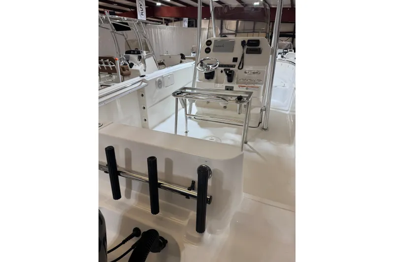 Slide: The Image of 2007 Wellcraft 232 Fisherman boat interior with steering console and rod holders. - 8