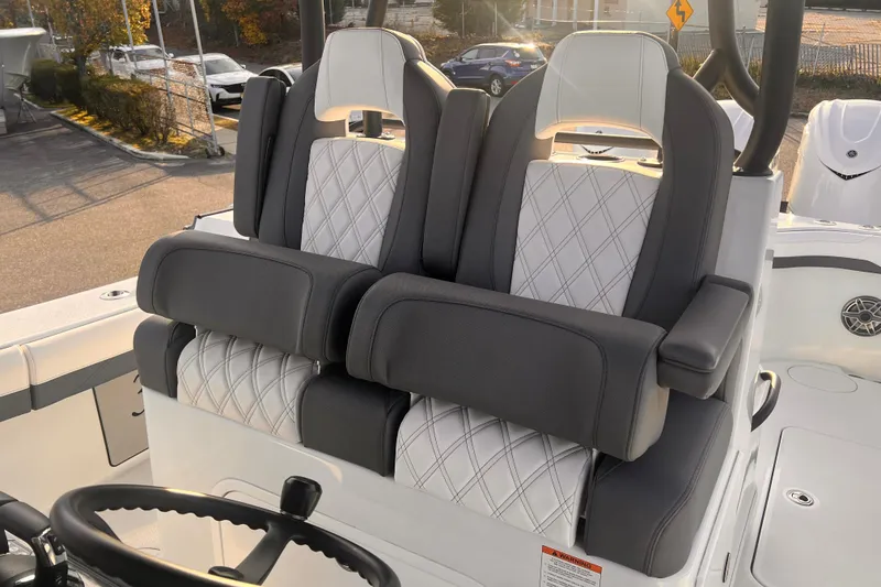 Slide: The Image of 2026 Yellowfin 36 Offshore boat seats with diamond-pattern upholstery and armrests. - 11