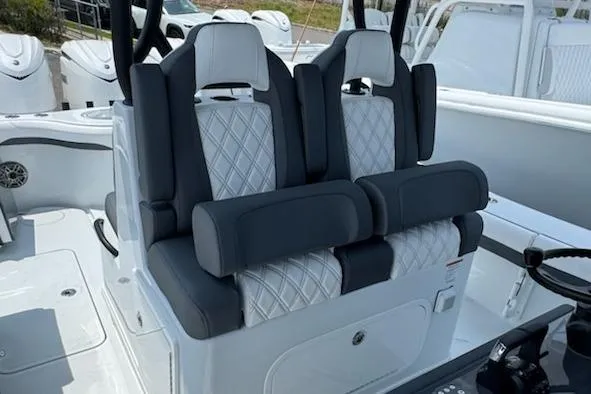 Slide: The Image of 2026 Yellowfin 36 Offshore boat seats with diamond-pattern upholstery and modern design. - 14
