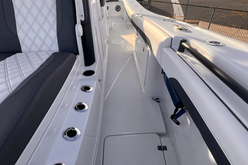 Slide: The Image of 2026 Yellowfin 36 Offshore boat interior with sleek seating and rod holders. - 18