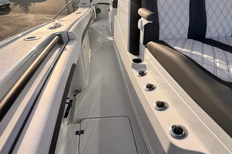 Slide: The Image of 2026 Yellowfin 36 Offshore boat interior with sleek seating and multiple rod holders. - 19