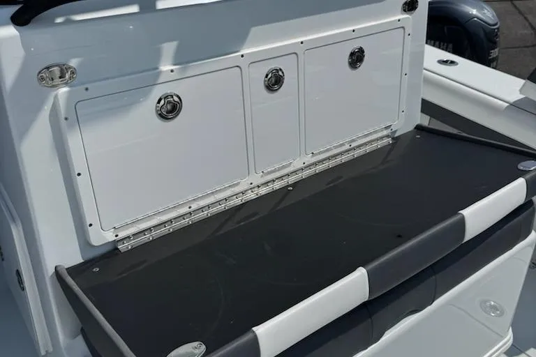 Slide: The Image of 2026 Yellowfin 36 Offshore boat with storage compartments and cushioned seating. - 4