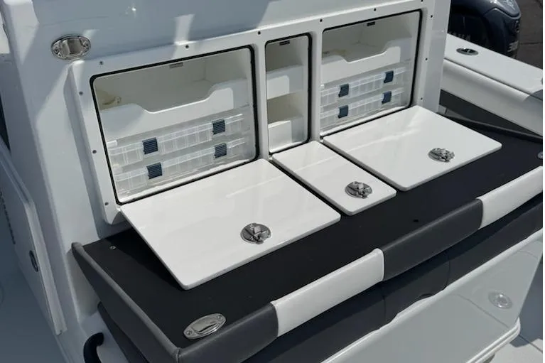 Slide: The Image of 2026 Yellowfin 36 Offshore boat with open storage compartments and sleek design. - 5