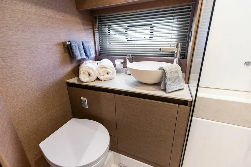 Slide: The Image of Luxurious bathroom in 2022 Prestige 420 yacht with modern fixtures and elegant design. - 20