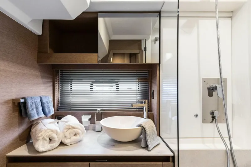 Slide: The Image of Luxurious bathroom in 2022 Prestige 420 yacht with modern fixtures and elegant design. - 21