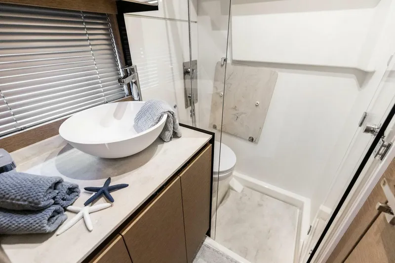 Slide: The Image of Modern bathroom in 2022 Prestige 420 yacht with sleek design and elegant fixtures. - 27