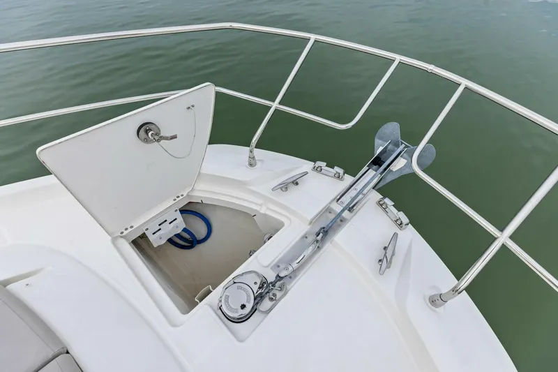 Slide: The Image of Bow of 2022 Prestige 420 yacht with anchor and open storage compartment. - 30