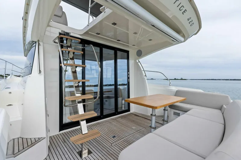 Slide: The Image of Luxurious 2022 Prestige 420 yacht deck with seating and ocean view. - 36