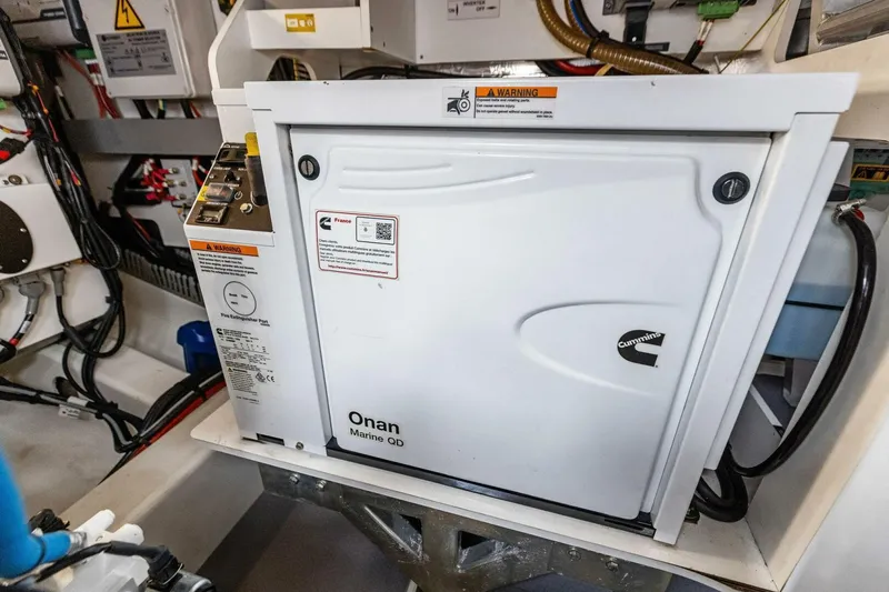 Slide: The Image of Engine room of 2022 Prestige 420 yacht featuring Cummins Onan Marine QD generator. - 45