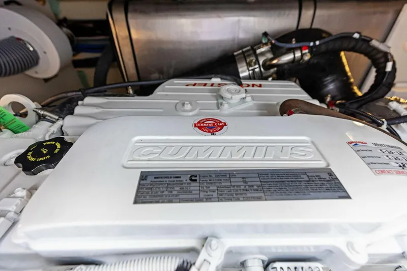Slide: The Image of Cummins engine in 2022 Prestige 420 yacht, showcasing detailed components and labels. - 47