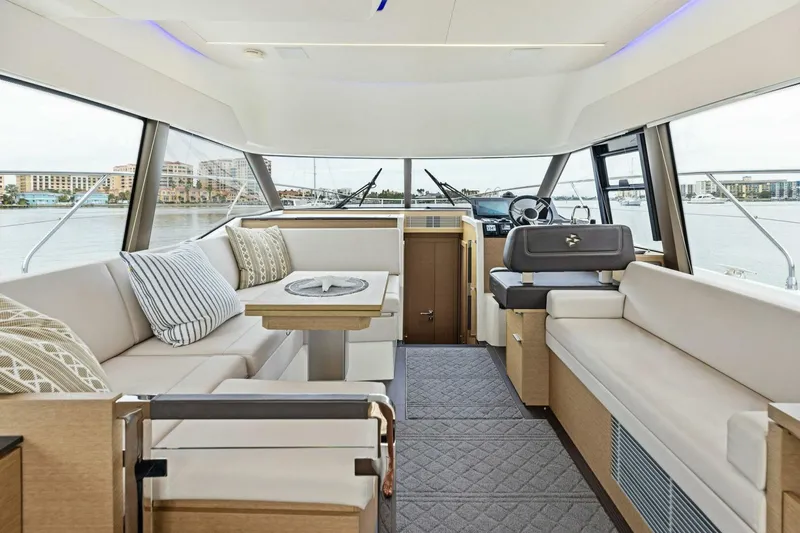 Slide: The Image of Luxurious interior of 2022 Prestige 420 yacht with elegant seating and panoramic windows. - 6