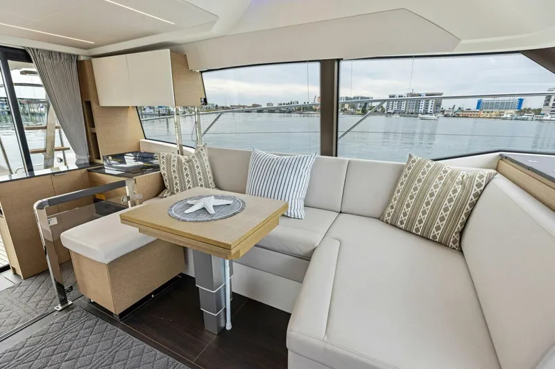 Slide: The Image of Luxurious interior of 2022 Prestige 420 yacht with elegant seating and waterfront view. - 9