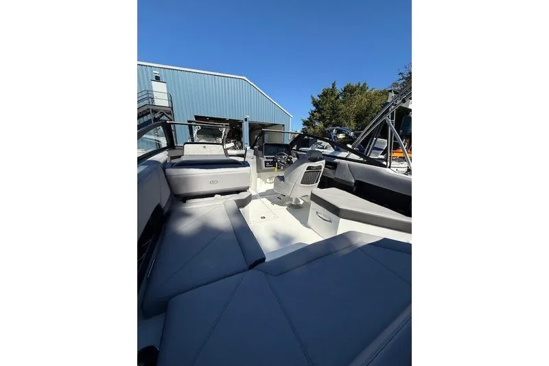 Slide: The Image of 2025 Cobalt R4 Outboard boat interior with modern seating and controls. - 8