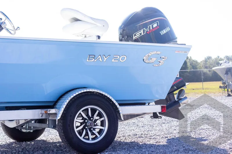 Slide: The Image of 2026 G3 Bay 20 boat with Yamaha engine, parked on gravel. - 13