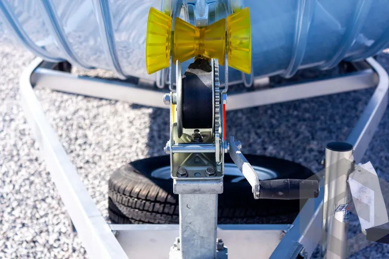 Slide: The Image of Trailer hitch mechanism of 2026 G3 Bay 20 on gravel surface. - 20