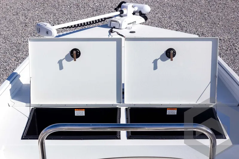 Slide: The Image of 2026 G3 Bay 20 boat with open storage compartments and Minn Kota trolling motor. - 22