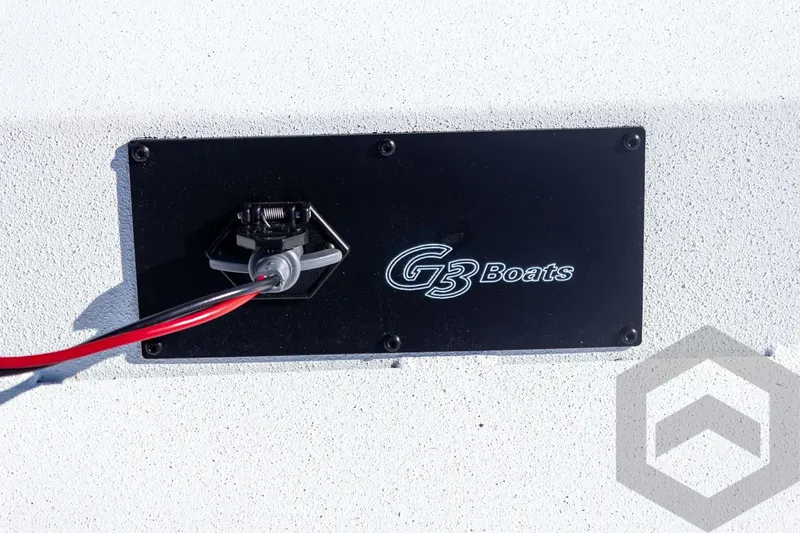 Slide: The Image of G3 Boats Bay 20, 2026 model, featuring a sleek black panel with wiring. - 27