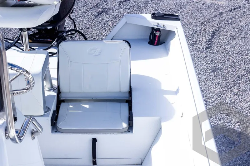 Slide: The Image of 2026 G3 Bay 20 boat interior with white seating and fire extinguisher. - 38