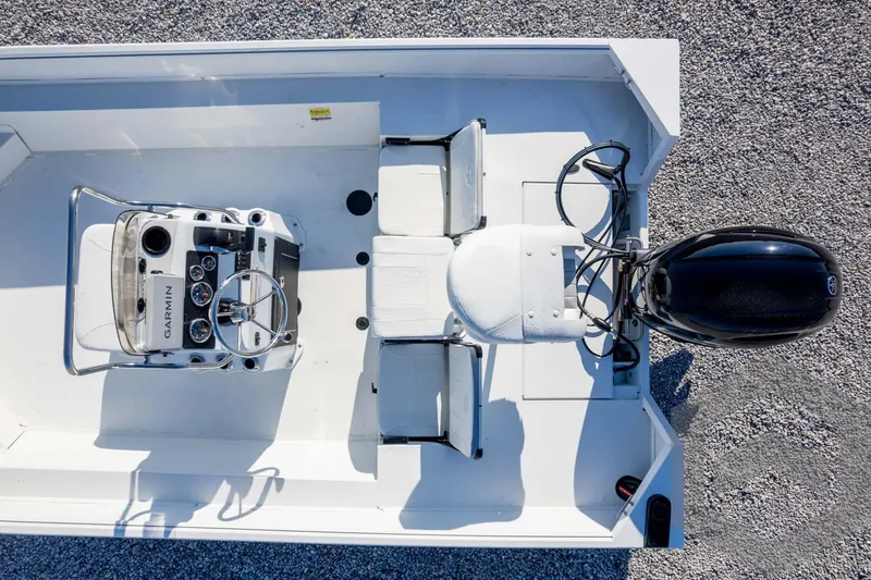 Slide: The Image of Overhead view of 2026 G3 Bay 20 boat interior with Garmin console and motor. - 43
