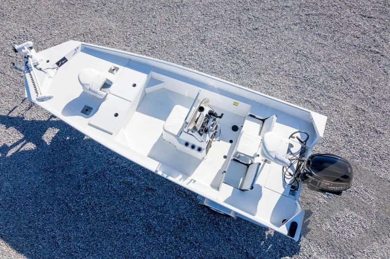 Slide: The Image of 2026 G3 Bay 20 boat, aerial view, white deck, gravel background. - 46