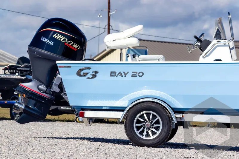 Slide: The Image of 2026 G3 Bay 20 boat with Yamaha engine on a trailer, parked outdoors. - 5