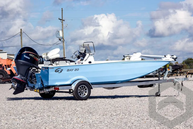 Slide: The Image of 2026 G3 Bay 20 boat with Yamaha engine on trailer, parked outdoors. - 7