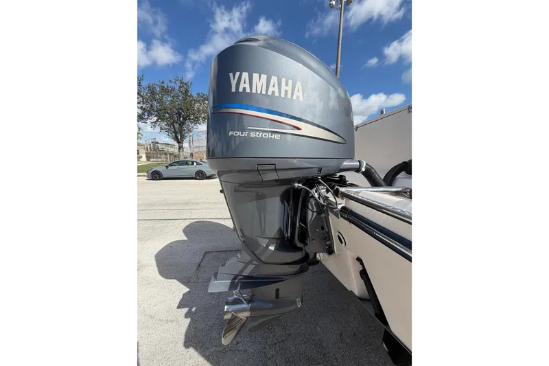 Slide: The Image of Yamaha four-stroke outboard motor on 2007 Grady-White Bimini 306 boat, sunny day. - 15