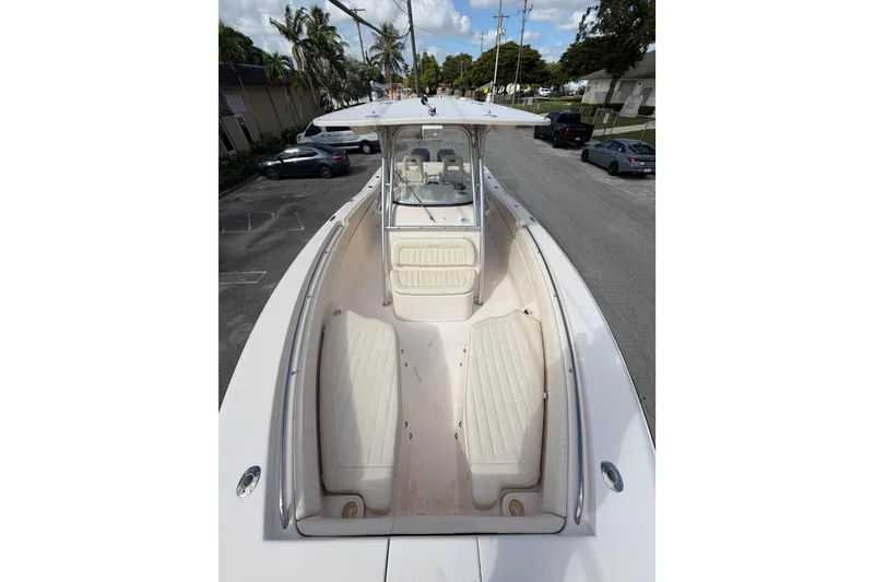 Slide: The Image of 2007 Grady-White Bimini 306 boat with spacious seating and sleek design. - 20