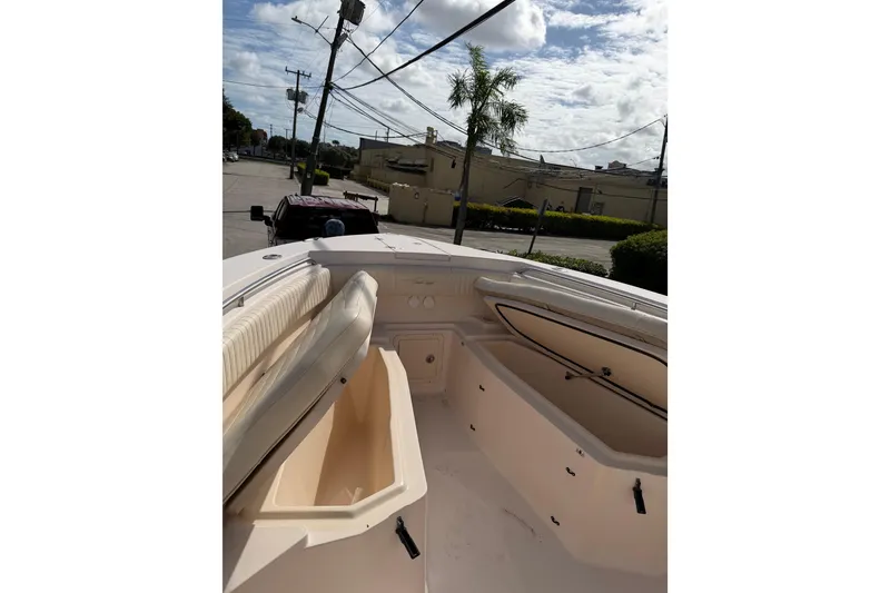 Slide: The Image of 2007 Grady-White Bimini 306 boat interior with open storage compartments. - 24