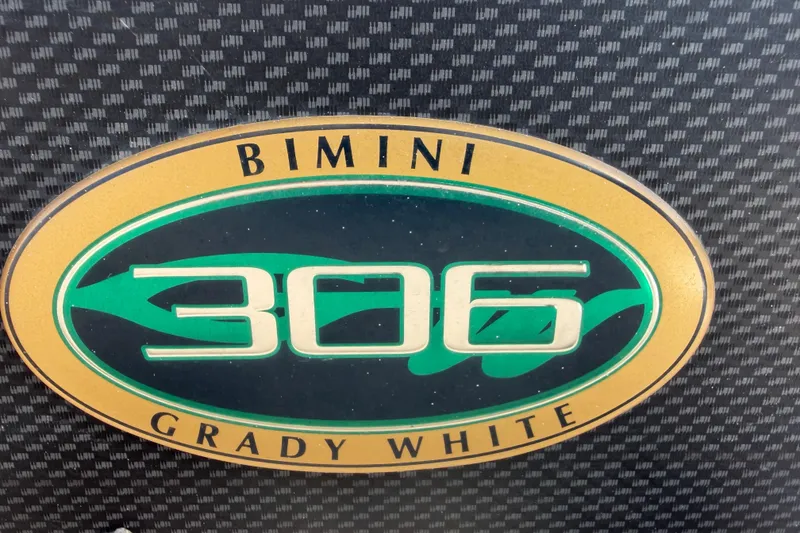 Slide: The Image of Grady-White Bimini 306 logo on textured background, 2007 model. - 30