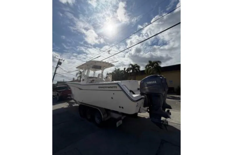 Slide: The Image of 2007 Grady-White Bimini 306 boat with Yamaha outboard, parked under a sunny sky. - 6