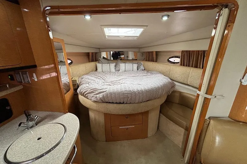 Slide: The Image of Interior of 2006 Chaparral Signature 350 yacht with cozy bed and kitchenette. - 16