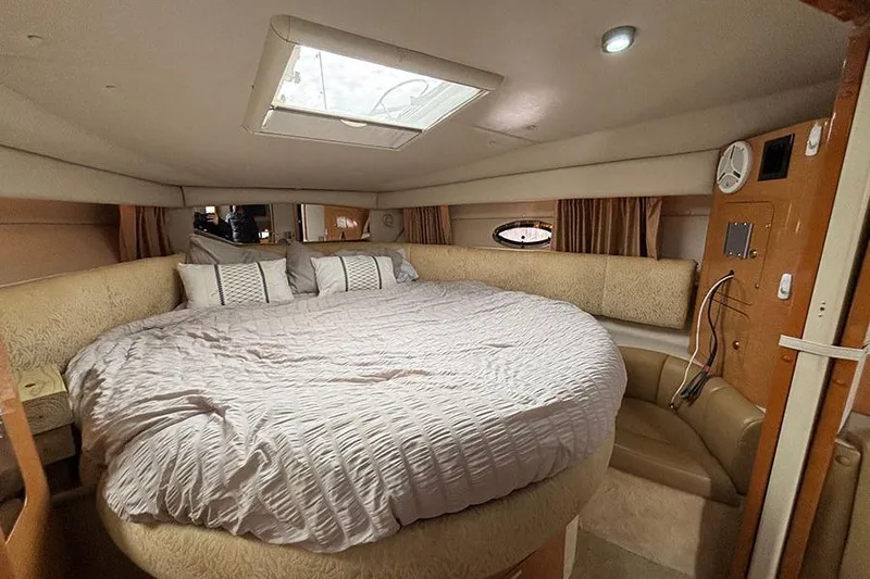 Slide: The Image of Luxurious interior of 2006 Chaparral Signature 350 yacht with spacious bed and elegant decor. - 17