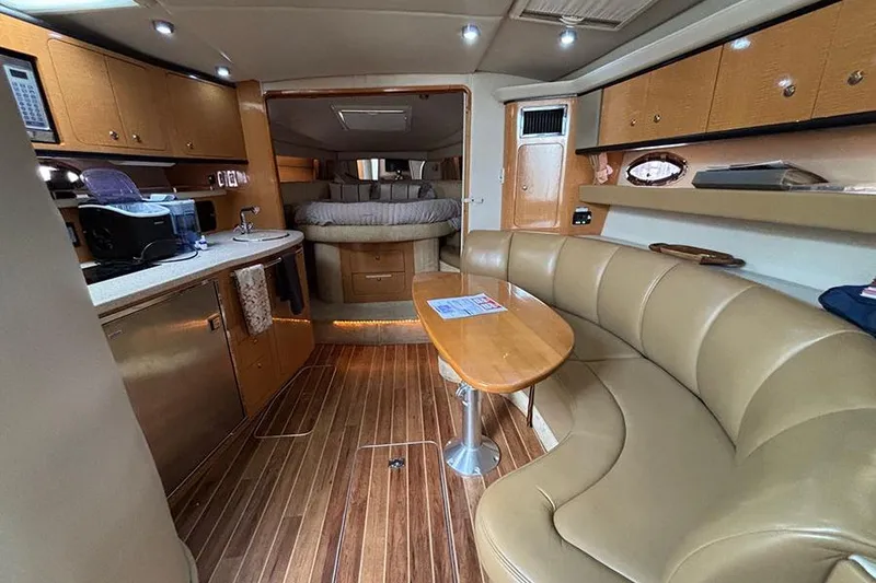 Slide: The Image of 2006 Chaparral Signature 350 yacht interior with wood flooring and cozy seating area. - 22