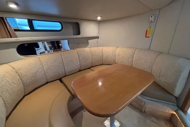 Slide: The Image of 2006 Chaparral Signature 350 interior with cozy seating and wooden table. - 26
