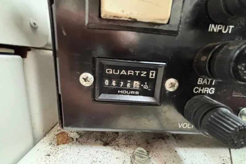 Slide: The Image of Hour meter reading 676 hours on 2006 Chaparral Signature 350 boat dashboard. - 28