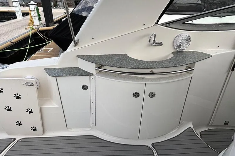 Slide: The Image of 2006 Chaparral Signature 350 boat interior with sink, countertop, and storage cabinets. - 8