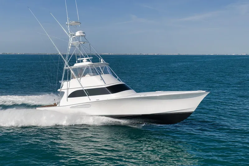 The Image of 2002 Weaver 60 Convertible yacht cruising on open blue sea. - 0