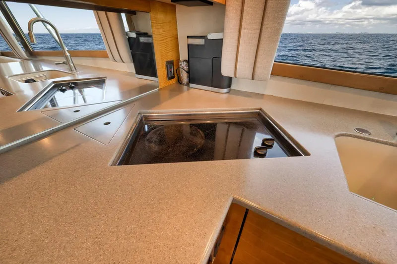 Slide: The Image of Luxurious kitchen interior on 2002 Weaver 60 Convertible yacht with ocean view. - 10