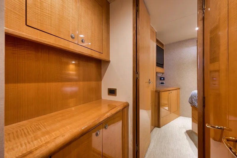 Slide: The Image of Luxurious wooden interior of a 2002 Weaver 60 Convertible yacht cabin. - 21
