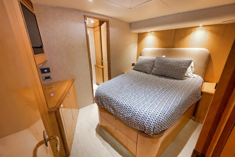 Slide: The Image of Luxurious bedroom interior of 2002 Weaver 60 Convertible yacht with modern decor. - 23