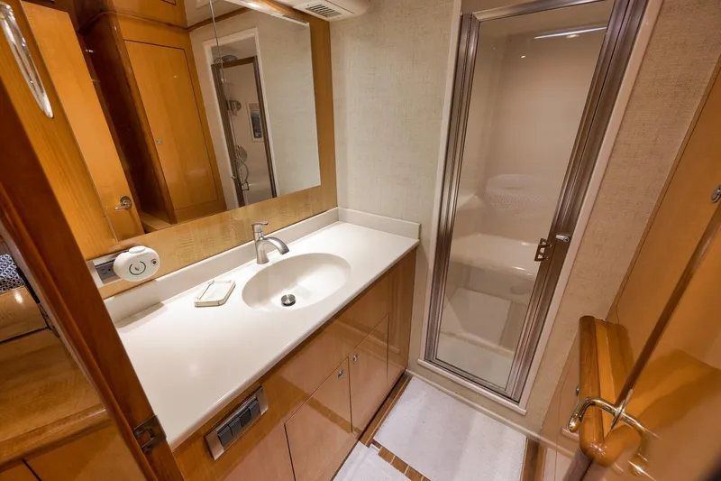 Slide: The Image of Luxurious bathroom in 2002 Weaver 60 Convertible yacht with modern fixtures and shower. - 24