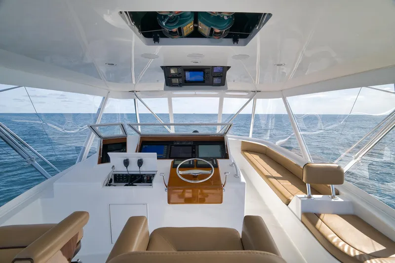 Slide: The Image of Interior view of 2002 Weaver 60 Convertible yacht helm with ocean backdrop. - 25